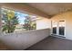 The covered balcony includes a door to the interior and overlooks the golf course at 8701 Robinson Ridge Dr, Las Vegas, NV 89117