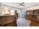 Bedroom with dark wood furniture, carpet floors, and a ceiling fan at 8701 Robinson Ridge Dr, Las Vegas, NV 89117