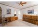 Bedroom with dark wood furniture, carpet floors, and a ceiling fan at 8701 Robinson Ridge Dr, Las Vegas, NV 89117