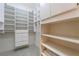 Walk-in closet with custom shelving and ample storage space at 8701 Robinson Ridge Dr, Las Vegas, NV 89117