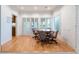 Formal dining room with wood floors, shuttered windows and view to yard at 8701 Robinson Ridge Dr, Las Vegas, NV 89117