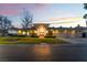 Inviting home exterior featuring a manicured lawn, mature landscaping, and ample parking at 8701 Robinson Ridge Dr, Las Vegas, NV 89117