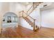 Staircase and hardwood floors of this home's large foyer at 8701 Robinson Ridge Dr, Las Vegas, NV 89117