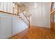 Staircase and hardwood floors of this home's elegant foyer at 8701 Robinson Ridge Dr, Las Vegas, NV 89117