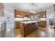 Spacious kitchen with a kitchen island, wood cabinets, and stainless steel appliances at 8701 Robinson Ridge Dr, Las Vegas, NV 89117