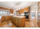 Spacious kitchen with a kitchen island, wood cabinets, and stainless steel appliances at 8701 Robinson Ridge Dr, Las Vegas, NV 89117