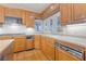 Kitchen featuring stainless steel appliances, wood cabinets, and lots of natural light at 8701 Robinson Ridge Dr, Las Vegas, NV 89117