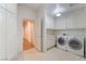 Laundry room with white cabinets, washer, and dryer at 8701 Robinson Ridge Dr, Las Vegas, NV 89117