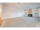 Bright living room featuring a fireplace and lots of natural light from the many windows at 8701 Robinson Ridge Dr, Las Vegas, NV 89117