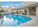 Backyard pool with blue water, complimented by the home's architecture and manicured landscaping at 8701 Robinson Ridge Dr, Las Vegas, NV 89117