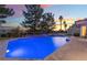 Backyard pool and spa create a tranquil retreat with lush landscaping and ample space for entertaining at 8701 Robinson Ridge Dr, Las Vegas, NV 89117