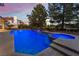 View of backyard pool and hot tub, surrounded by lush landscaping and towering trees at 8701 Robinson Ridge Dr, Las Vegas, NV 89117