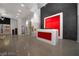 Chic lobby area with a red and white reception desk and artistic wall feature at 900 Las Vegas Blvd # 804, Las Vegas, NV 89101