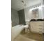 Updated bathroom features a shower-tub combination with modern tile and a vanity with storage at , Las Vegas, NV 89102