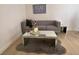 Cozy living room featuring a comfortable gray sofa and a modern mirrored coffee table at , Las Vegas, NV 89102