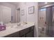 Neat bathroom featuring a sink and vanity with a mirror, leading to a shower and toilet area at 10139 Palazzo Marcelli Ct, Las Vegas, NV 89147