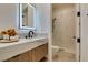 Bathroom featuring a modern vanity with countertop, a sleek shower, and stylish fixtures at 10313 Orkiney Dr, Las Vegas, NV 89144