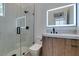 Modern bathroom featuring a glass-enclosed shower and a wood vanity at 10313 Orkiney Dr, Las Vegas, NV 89144