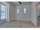 Bright bedroom with tile flooring, neutral paint, and shuttered windows at 10313 Orkiney Dr, Las Vegas, NV 89144