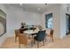 Dining room with natural light, wood floors, and view to backyard at 10313 Orkiney Dr, Las Vegas, NV 89144