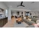 Stylish living room with contemporary furnishings, an open layout, and seamless integration with the kitchen at 10313 Orkiney Dr, Las Vegas, NV 89144