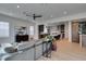 Open-concept living room with modern decor, flowing into the kitchen and dining area at 10313 Orkiney Dr, Las Vegas, NV 89144