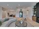 Bright living room with wood flooring and modern decor open to dining area at 10313 Orkiney Dr, Las Vegas, NV 89144