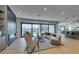 Open-concept living room featuring hardwood floors, a fireplace and large sliding doors to the backyard at 10313 Orkiney Dr, Las Vegas, NV 89144