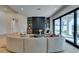 Bright living room with a modern fireplace, custom shelving, and sliding glass doors to the backyard at 10313 Orkiney Dr, Las Vegas, NV 89144