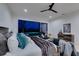 Tranquil main bedroom showcasing a king bed, designer accents, and a large sliding glass door with a view of the pool at 10313 Orkiney Dr, Las Vegas, NV 89144