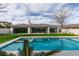 View of the pool and backyard from the pool deck at 10313 Orkiney Dr, Las Vegas, NV 89144