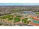 Aerial view of community with green spaces, tennis courts, and school at 10421 Mount Washington Ave, Las Vegas, NV 89166