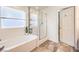 Bathroom with a separate shower and tub at 10421 Mount Washington Ave, Las Vegas, NV 89166