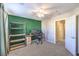 Bedroom featuring an accent wall, a ceiling fan, and neutral walls at 10421 Mount Washington Ave, Las Vegas, NV 89166