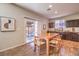 Open dining area with wood floors and sliding glass doors to the patio at 10421 Mount Washington Ave, Las Vegas, NV 89166