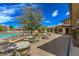 Charming outdoor dining area with tables, chairs, and a view of the pool at 10421 Mount Washington Ave, Las Vegas, NV 89166