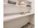 Organized pantry featuring ample counter space, neutral tones, and overhead shelving at 10421 Mount Washington Ave, Las Vegas, NV 89166