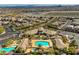 Aerial view of community pool and recreational area with multiple pools and clubhouse at 10421 Mount Washington Ave, Las Vegas, NV 89166