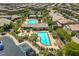 Aerial view of neighborhood pool and recreational area surrounded by lush landscaping at 10421 Mount Washington Ave, Las Vegas, NV 89166