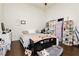 Bright bedroom with wood-look floors, white walls, and large window offering plenty of space for storage at 1092 Via Corto St, Henderson, NV 89011