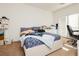 Bright bedroom features neutral walls, carpet floors, white trim and a door to the patio at 1092 Via Corto St, Henderson, NV 89011