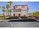 Three-story townhome featuring neutral stucco, a covered entry, and ample parking in front at 1092 Via Corto St, Henderson, NV 89011