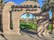 Entrance to Chimera Golf Club with view of the green, desert landscape and mountain backdrop at 1092 Via Corto St, Henderson, NV 89011