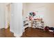 Bright hallway with dark laminate flooring, leading to bedrooms and bathrooms, and plenty of storage space at 1092 Via Corto St, Henderson, NV 89011