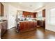 Kitchen featuring dark wood cabinets, stainless steel appliances, and a center island at 1092 Via Corto St, Henderson, NV 89011