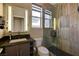 Modern bathroom with a sleek vanity, tiled shower, and contemporary fixtures for a spa-like experience at 11023 Bellatrix Ct, Las Vegas, NV 89135