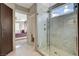 Bathroom with marble shower and direct access to the main bedroom at 11023 Bellatrix Ct, Las Vegas, NV 89135