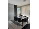 Dining area with a dark wood table, stylish chairs, and a unique wall design with a geometric rug at 11023 Bellatrix Ct, Las Vegas, NV 89135