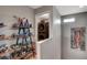 Hallway with built-in shelves displaying collectibles and a laundry room at 11023 Bellatrix Ct, Las Vegas, NV 89135