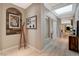 Bright hallway with wood floors, modern decor, and a skylight, creating an inviting and stylish entrance at 11023 Bellatrix Ct, Las Vegas, NV 89135